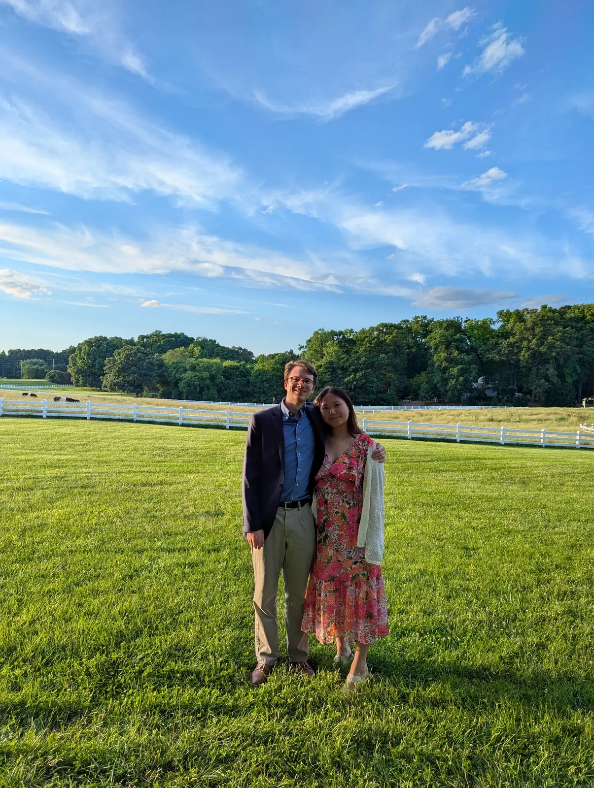 Angela and Sean together in a lush green field