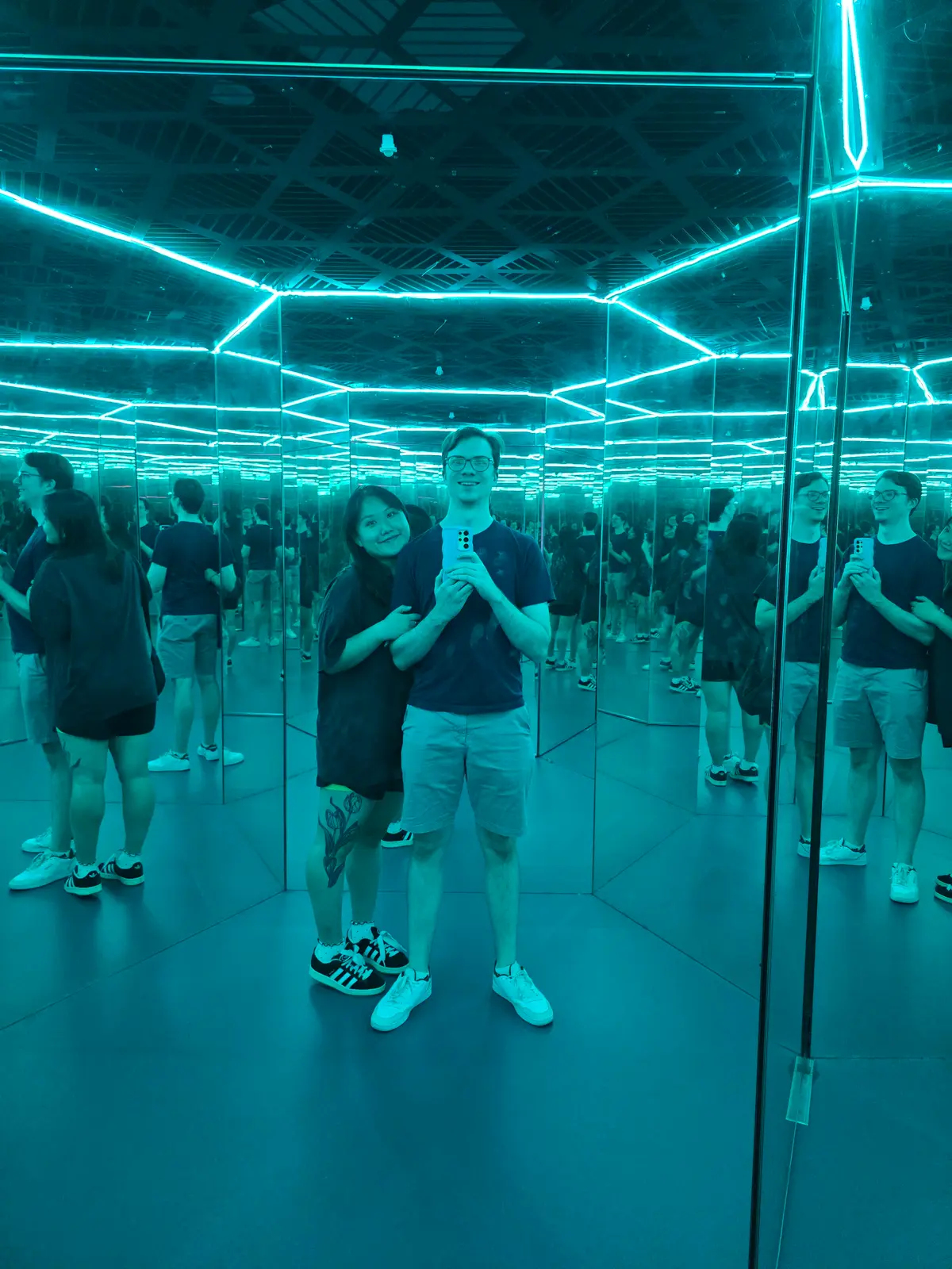 Angela and Sean surrounded by mirror reflections