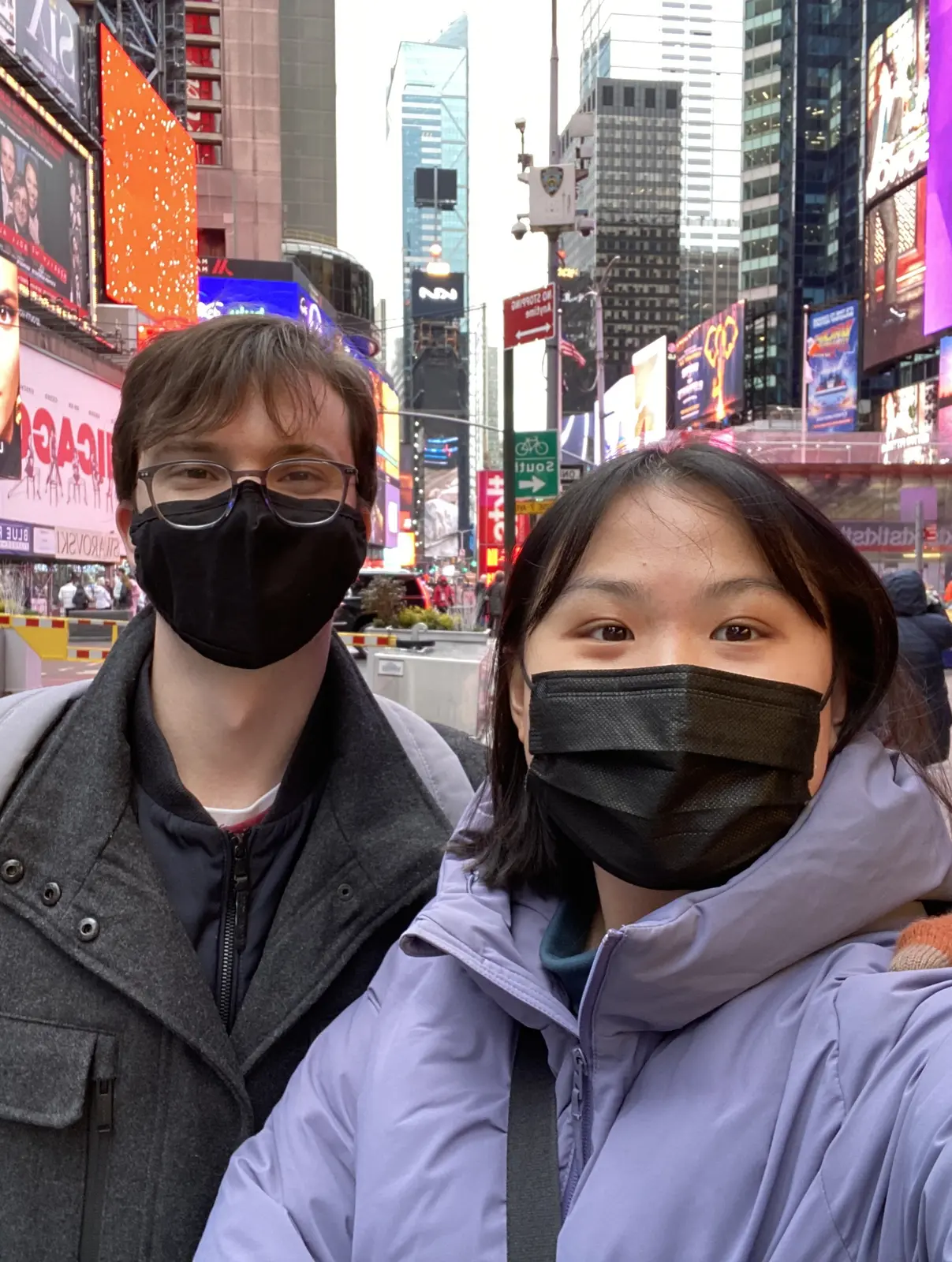 Angela and Sean wearing masks in Times Square
