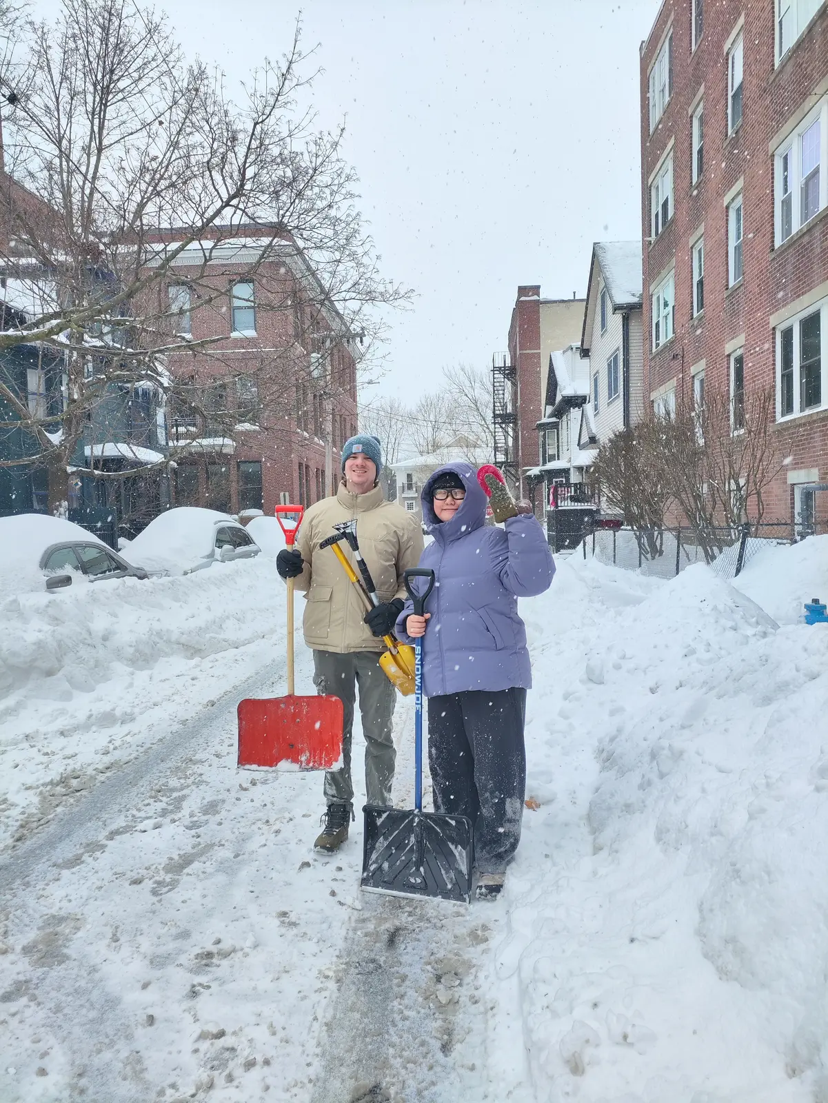 Angela and Sean shoveling snow together